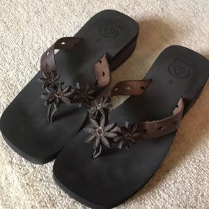 Reef brown leather flip flops with flower details